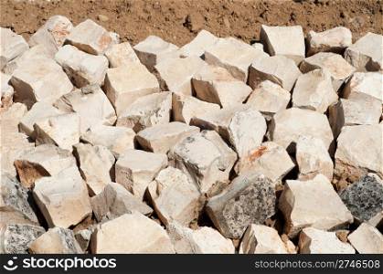 stones barricade to prevent landslides on a small yard
