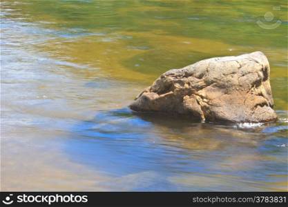 stones in river in deep forest, abstract nature background