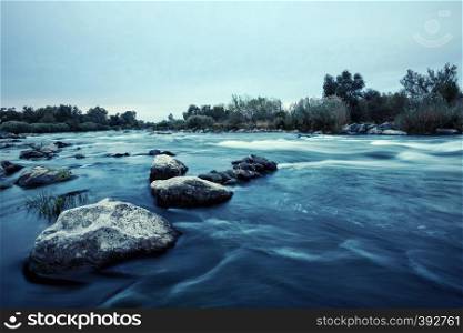 Stones in the water on a shallow mountain river. Stones in the water on shallow mountain river