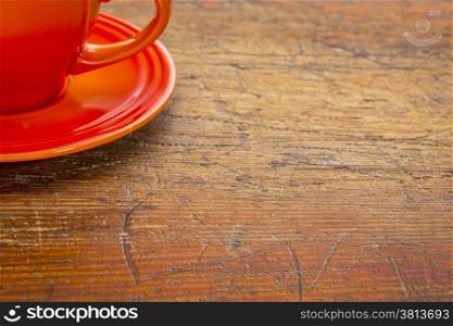 stoneware coffee cup on grunge rustic wooden table with a copy space