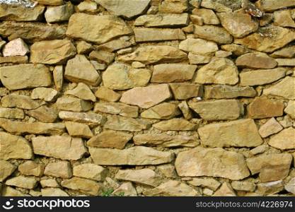 Stonework - a fragment of a stone wall in the Caucasian village