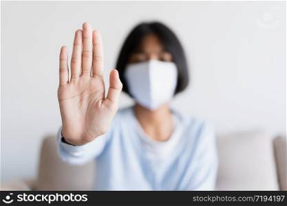 Stop hand corona virus epidemic. Asian girl wearing the mask for protect outbreak and Quarantine at home