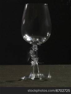 Stop motion photography. By use of a sound activated switch, I am able to capture the moment that a glass breaks. Pictured here a glass of red wine.