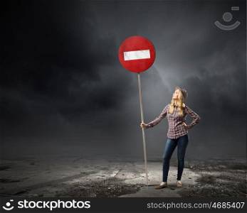 Stop pollution. Young girl in casual holding stop sign