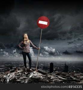 Stop pollution. Young girl in casual holding stop sign