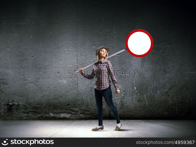 Stop pollution!. Young girl in casual holding stop sign