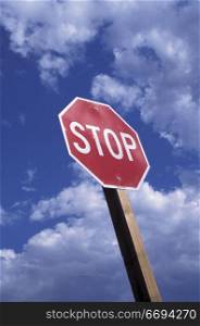 Stop Sign and Blue Sky with Clouds