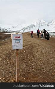 Stop sign polar bear danger in Ny Alesund, Svalbard islands, Norway. Stop sign in Ny Alesund, Svalbard islands