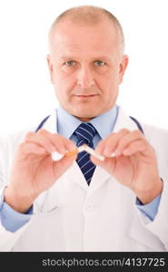 Stop smoking mature doctor male breaks cigarette focus on hand