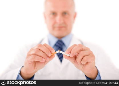 Stop smoking mature doctor male breaks cigarette focus on hand