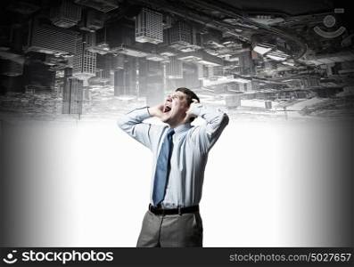Stop that sound. Frustrated businessman screaming and covering his ears with hands