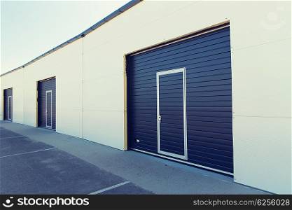 storage, building structure and architecture concept - garage or warehouse exterior