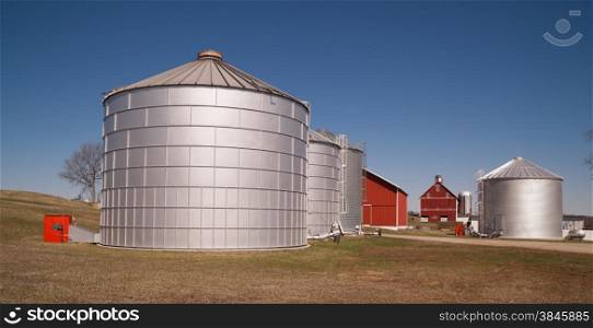 Storage silos sit in waiting to be filled on the farm