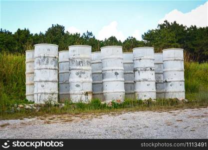 Storage water tank concrete cement on hill and meadow background