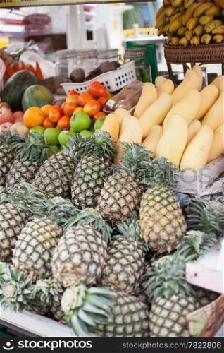 Store fruits are pineapple, mango, orange and watermelon. Market sales.