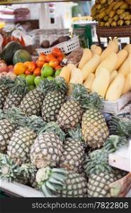Store fruits are pineapple, mango, orange and watermelon. Market sales.