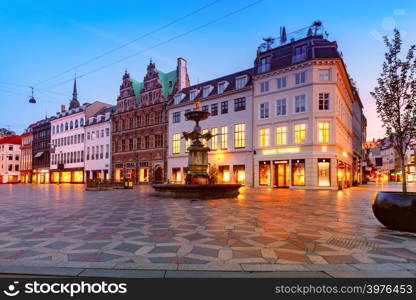 Stork Fountain on the Amagertorv square, Stroget street during morning blue hour, Copenhagen, capital of Denmark. Stroget street, Amagertorv, Copenhagen, Denmark