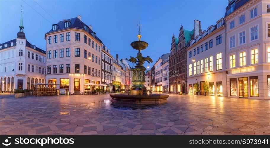 Stork Fountain on the Amagertorv square, Stroget street during morning blue hour, Copenhagen, capital of Denmark. Stroget street, Amagertorv, Copenhagen, Denmark