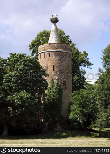 Stork Tower Ziesar with two storks. Storks in their nest on the tower of the castle Ziesar Storch, Brandenburg, Germany