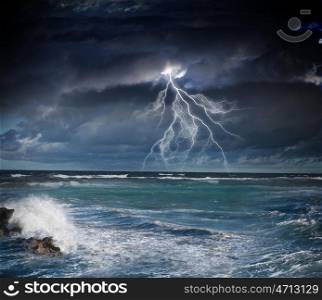 Storm at night. Image of dark night with lightning above stormy sea