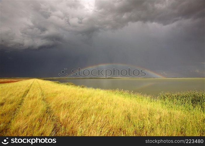Storm clouds and rainbow over Chaplin Lake Marshes