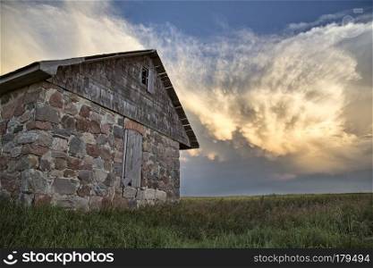 Storm Clouds Saskatchewan Prairie scene Stone house