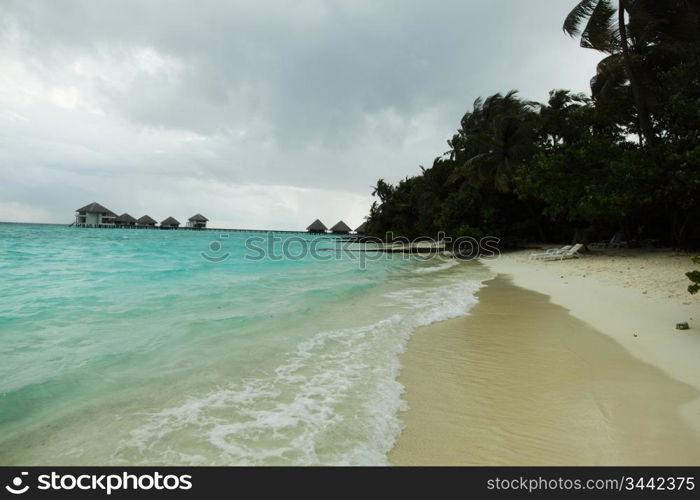 storm on tropical island palm sea and sky