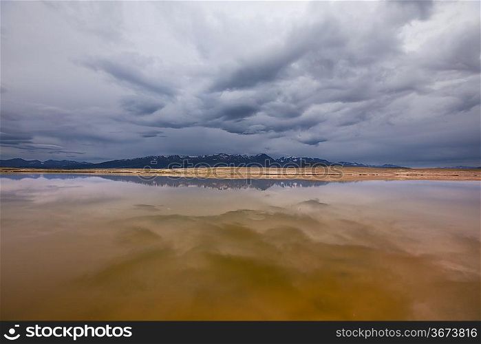 Storm sky over lake,Mongolia