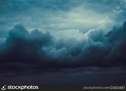 Storm sky with dark grey cumulus clouds. Thunderstorm