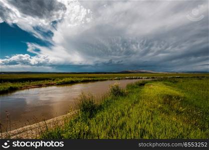 Stormy clouds above river in Wyoming, USA