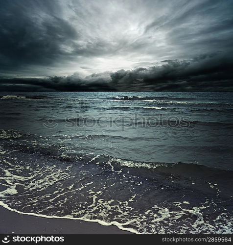 Stormy clouds over dark ocean