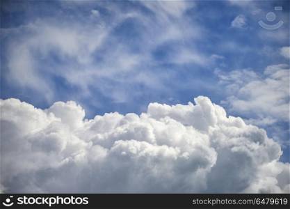 Stormy cumulus clouds with high level cirrocumulus clouds for use as background. Dramatic cumulus clouds with high level cirrocumulus clouds for
