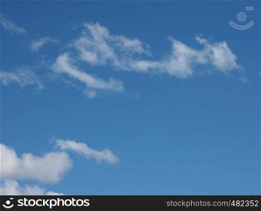stormy dark blue sky with clouds useful as a background. dark blue sky with clouds background