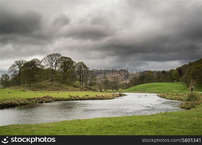 Stormy dramatic sky over Lake District landscape in England