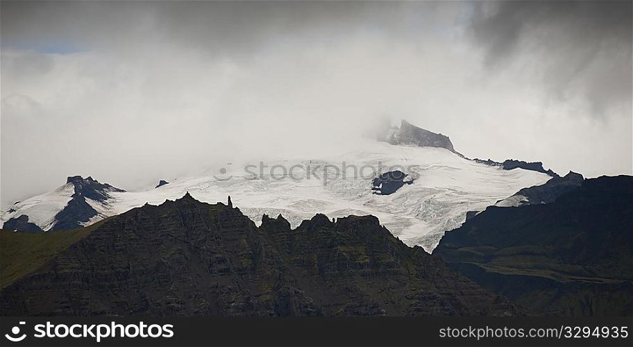 Stormy jagged mountain peak in a storm