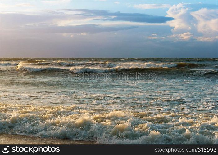 stormy sea at sunset, waves and wind at sunset. waves and wind at sunset, stormy sea at sunset