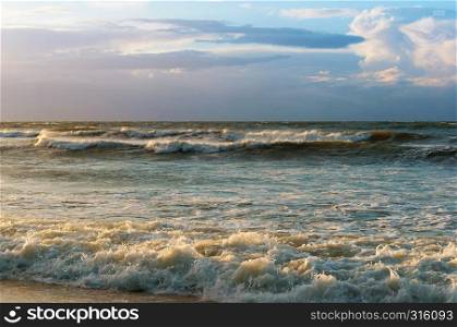 stormy sea at sunset, waves and wind at sunset. waves and wind at sunset, stormy sea at sunset