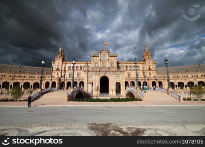 Stormy sky above the Renaissance Revival Plaza de Espana (Spain&rsquo;s Square) in Seville, Spain, Andalusia region.