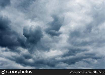 Stormy sky covered with dark dramatic clouds