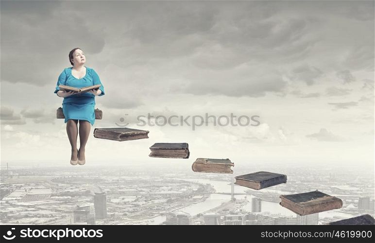 Stout woman. Plus size middle aged woman with book in hands