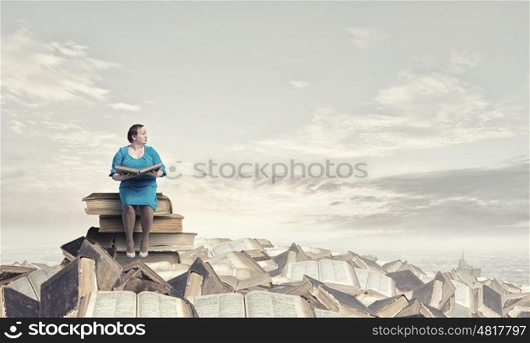 Stout woman. Plus size middle aged woman with book in hands