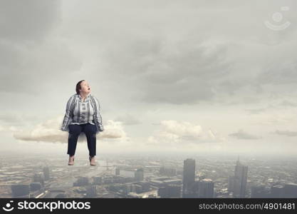 Stout woman. Plus size woman in casual sitting on cloud