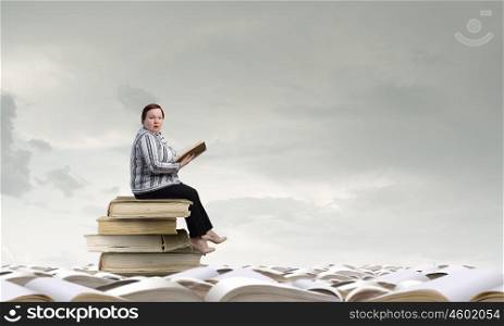 Stout woman. Plus size woman sitting with book in hands