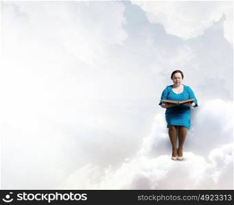 Stout woman. Plus size woman with book in hands sitting on cloud