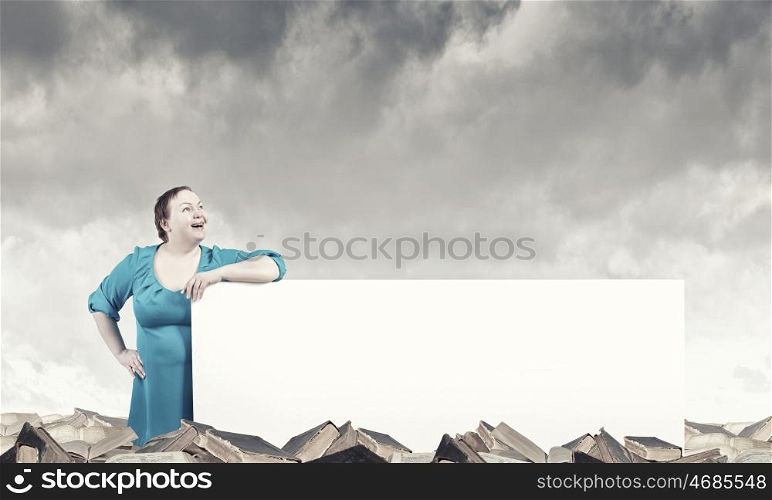 Stout woman with banner. Stout confident woman of middle age with blank white banner