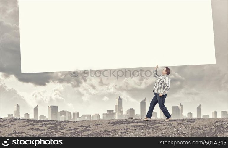 Stout woman with banner. Stout woman of middle age carrying blank white banner