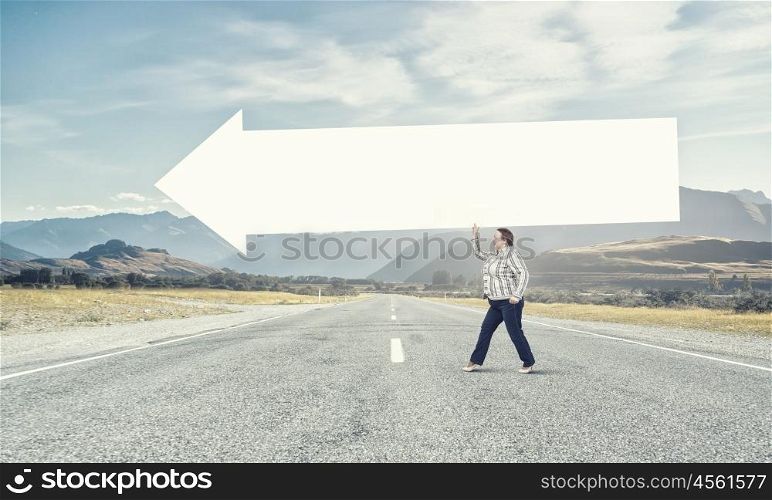 Stout woman with banner. Stout woman of middle age with blank white arrow banner