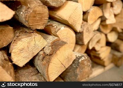 stove heating and wood fuel concept - close up of firewood. close up of firewood