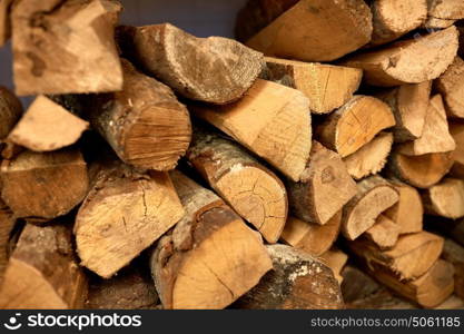 stove heating and wood fuel concept - firewood. close up of firewood