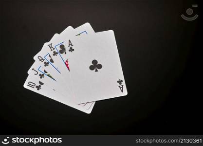 Straight flush - playing cards on dark background.. Straight flush - playing cards on dark background